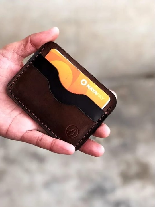 The Maverick Card Sleeve held in hand with a card inside