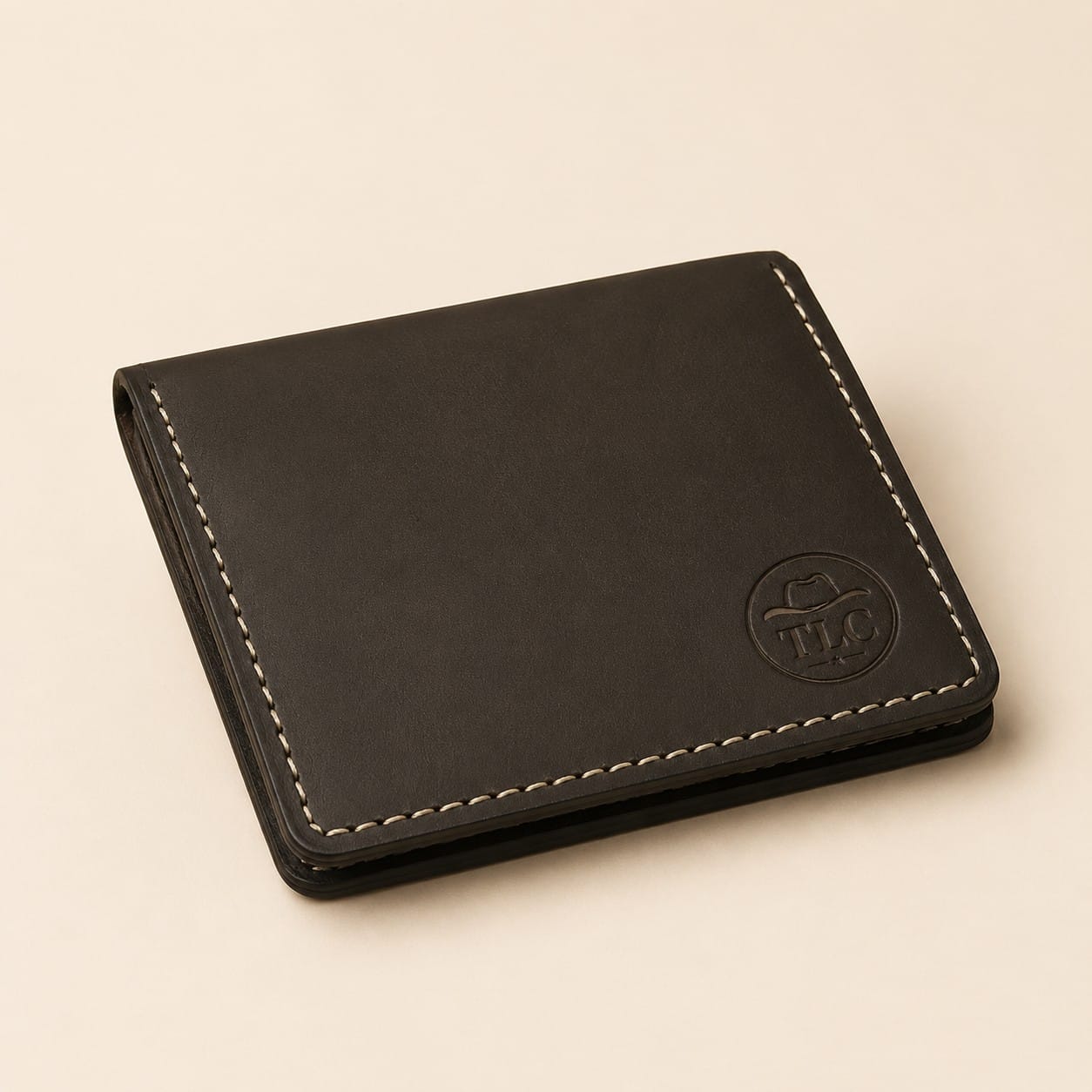 TLC Artisan Edge Wallet in black-brown leather, closed view