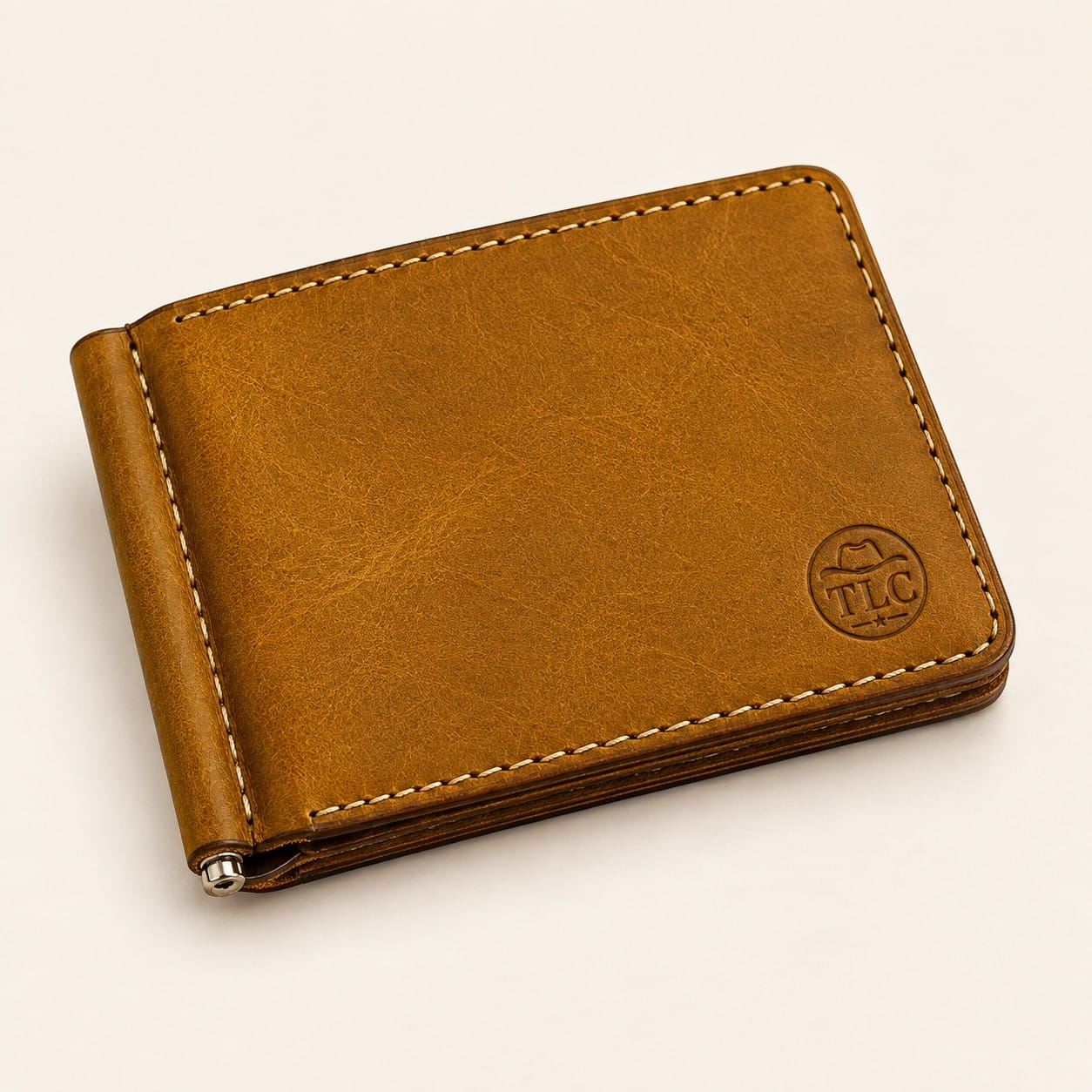 TLC Heritage Craft Money Clip Wallet in tan-cognac leather, closed flat view with TLC deboss