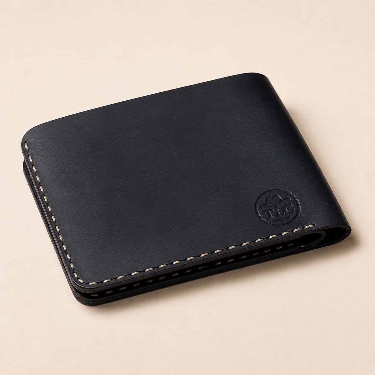 TLC Heritage Edge Bifold Wallet in charcoal-black leather, closed view