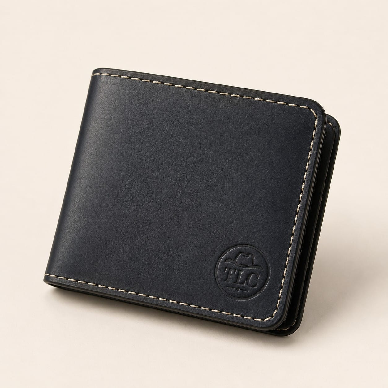 TLC Heritage Noir Bifold Wallet in deep navy-black leather, closed view