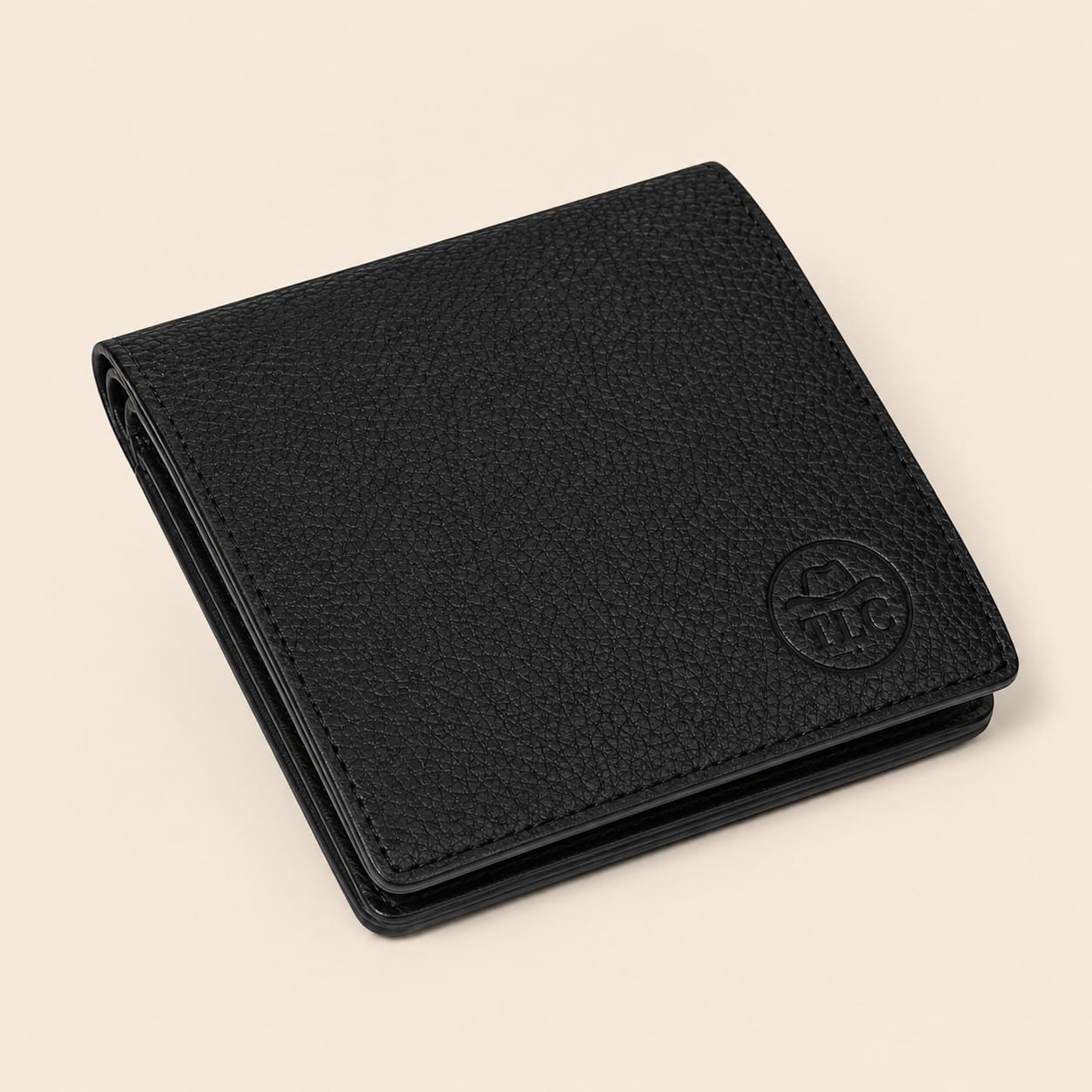 TLC Noir Classic Bifold Wallet in black pebbled leather, closed view